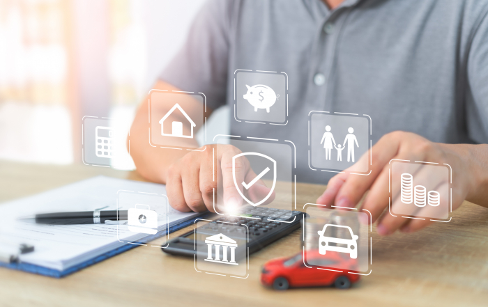 Insurance covering life, health, home, car, travel concept icon on screen,A man use calculator for calculate and plan for sustainable family security financial and future plan